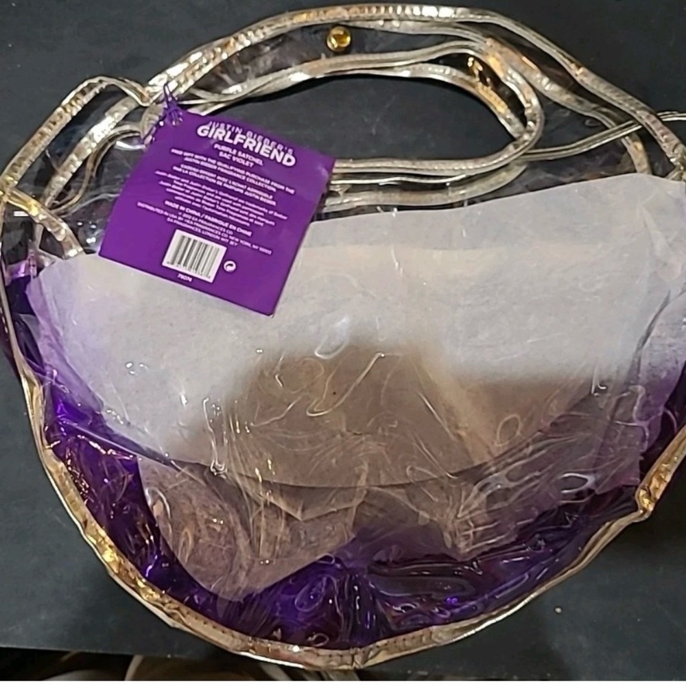 Justin Bieber Fragrances Clear and Purple crossbody with Gold Accents clear hand